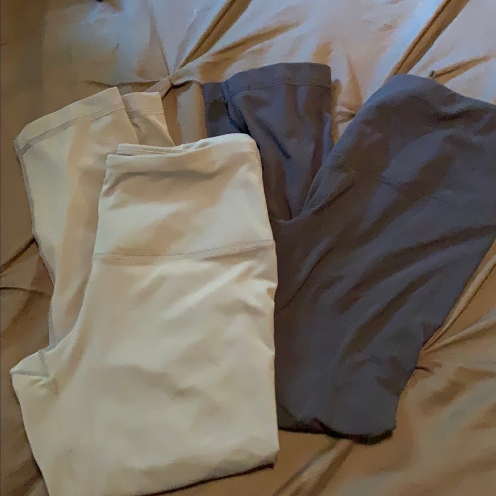 Two identical pairs of yoga pants cropped